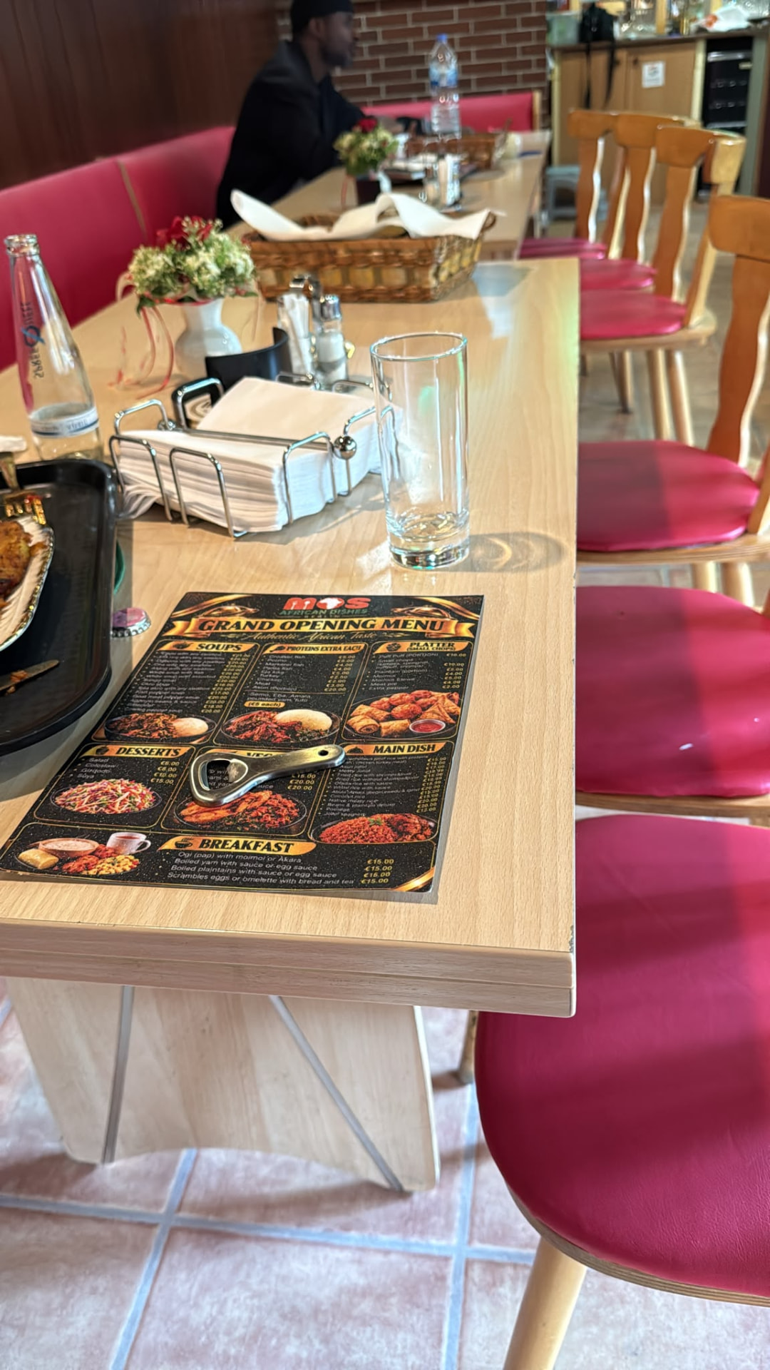 The grand opening menu card on a laid table